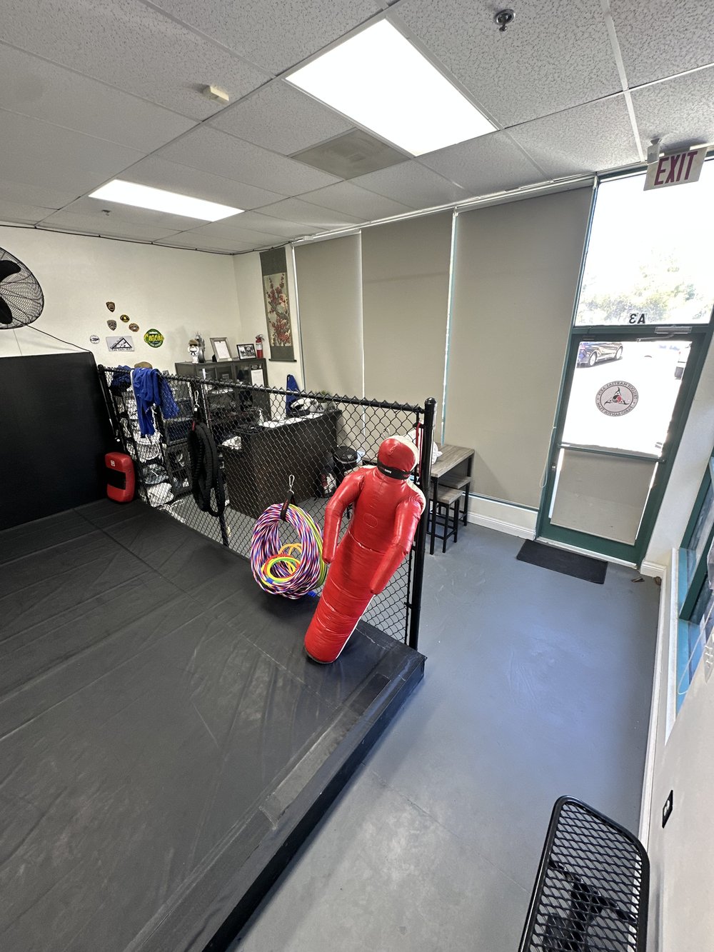 Training equipment and cage at Trilogy Martial Arts