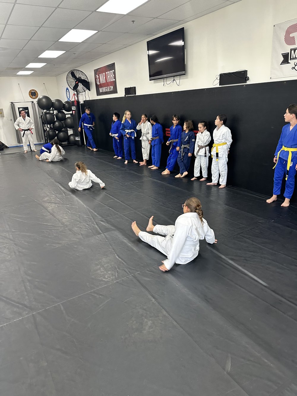 Students lined up in gi at Trilogy Martial Arts